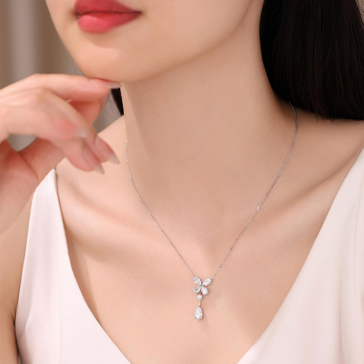 DANFÉE butterfly pear drop lab-grown diamond necklace on model, 18 inch chain