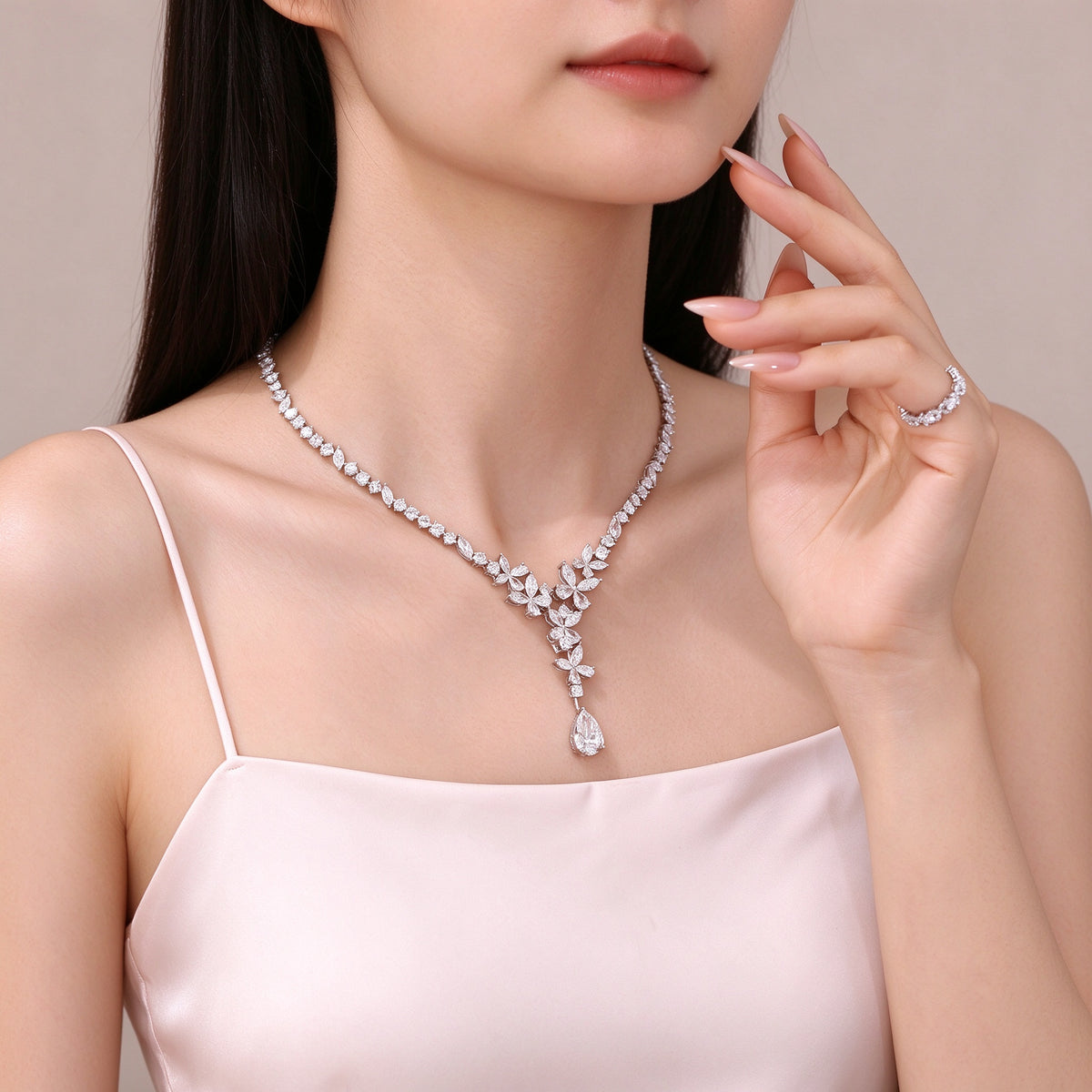 Model wearing 5 carat pear drop lab-grown diamond necklace in PT950 platinum for evening and bridal