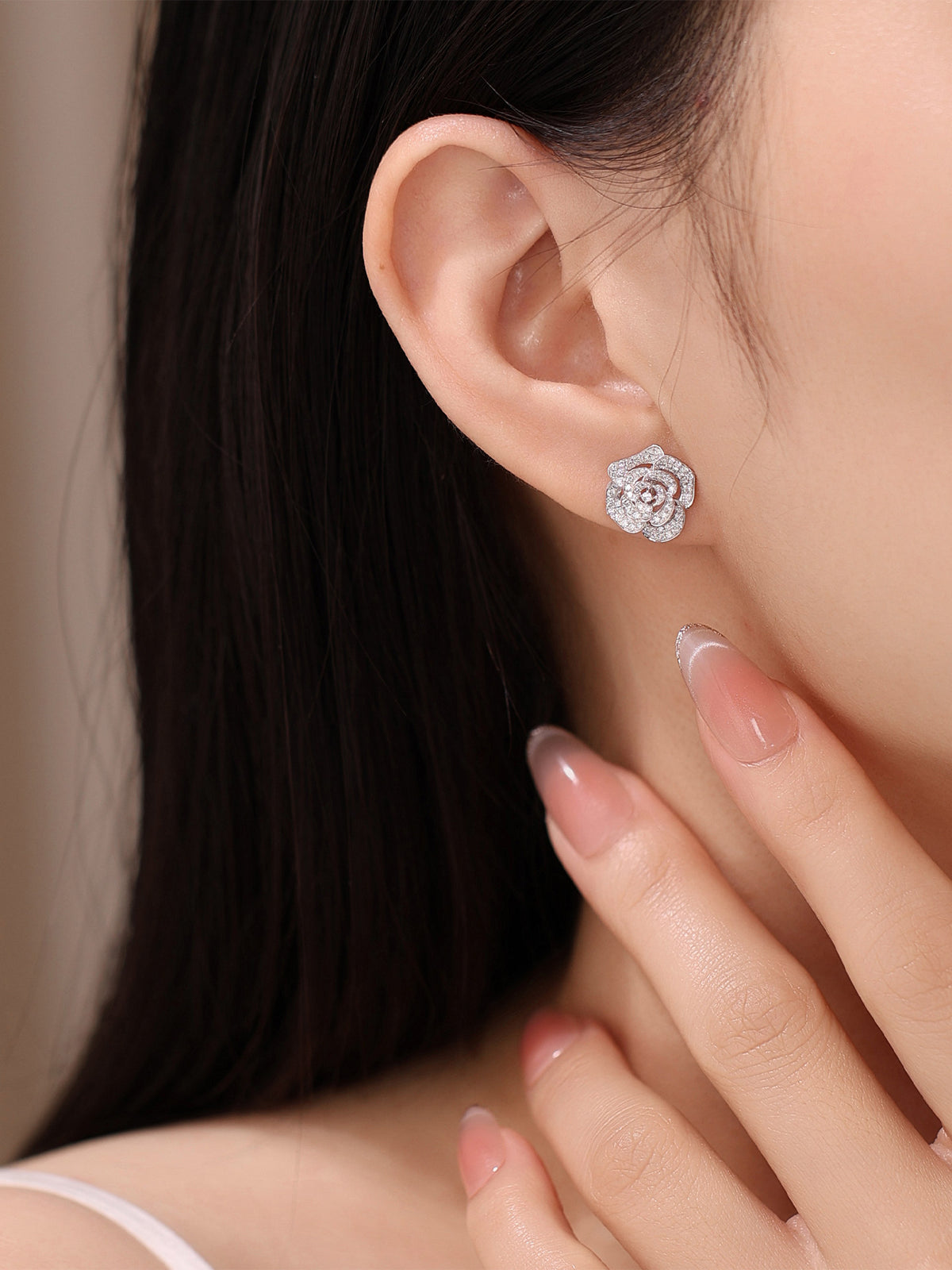 Camellia lab-grown diamond stud earring worn on the ear