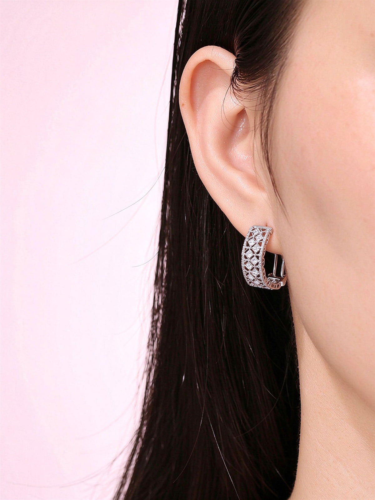 Dentelle lab-grown diamond lace huggie earring close-up on model