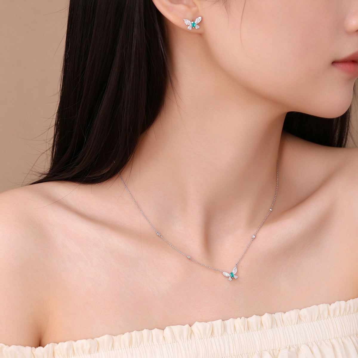 DANFÉE Paraiba butterfly diamond necklace styled with butterfly stud earrings