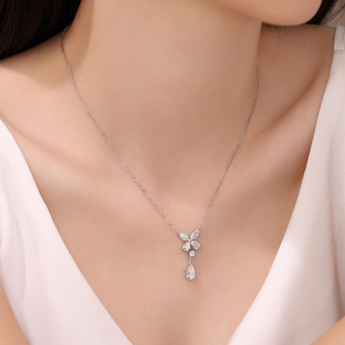 DANFÉE butterfly pear drop lab-grown diamond necklace on model with V-neck