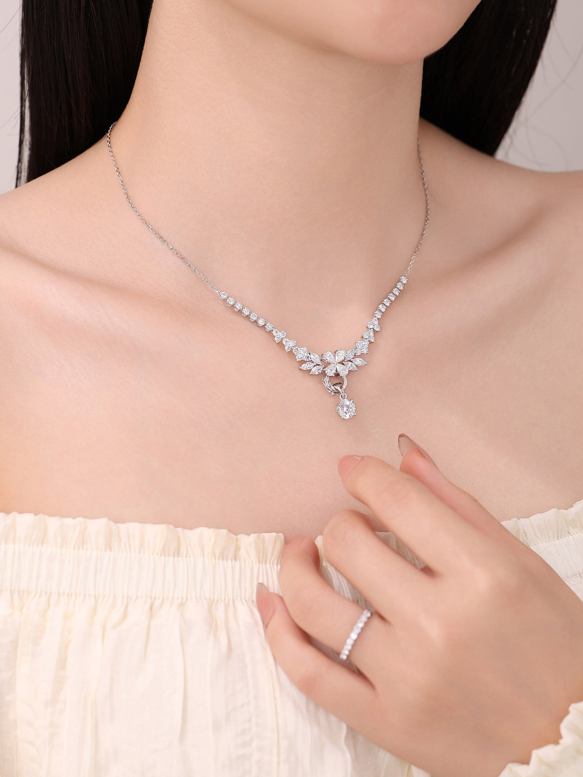 Model wearing DANFÉE Blossom Cluster necklace with 1 carat diamond pendant