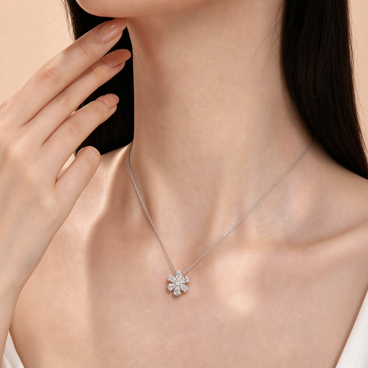 DANFÉE Forget-Me-Not pear-cut diamond flower necklace on model, close-up