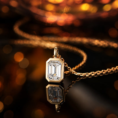 DANFÉE emerald-cut bezel lab-grown diamond necklace on a reflective dark surface