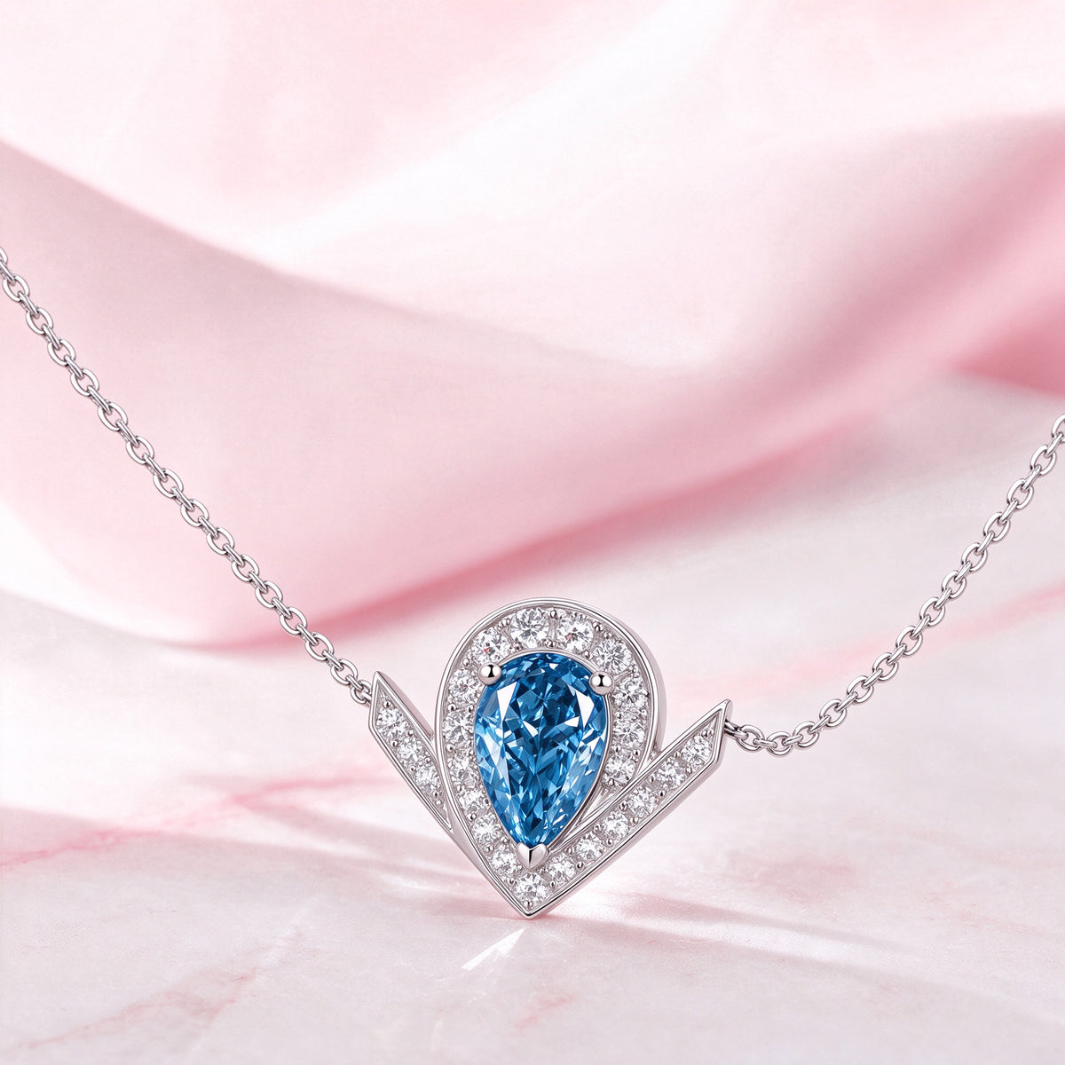 DANFÉE Chevron Pear Halo blue diamond pendant with pink silk