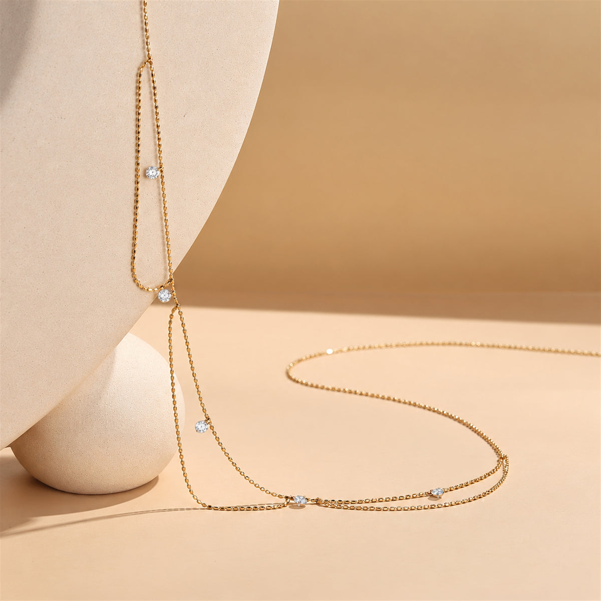 DANFÉE Goddess draped lab-grown diamond necklace, warm beige display scene — 3.jpg