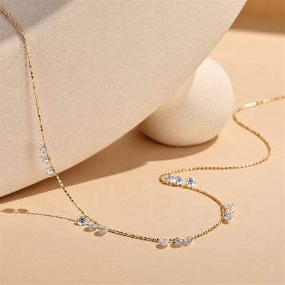 DANFÉE diamond necklace draped in a warm beige setting