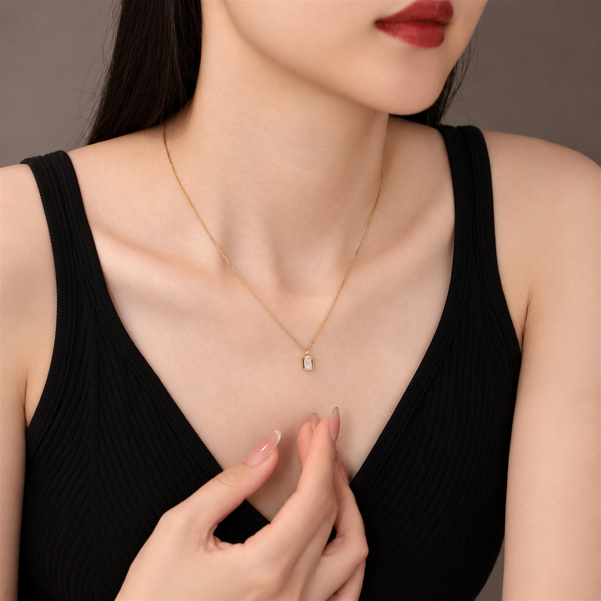 DANFÉE emerald-cut bezel lab-grown diamond necklace worn with a black top