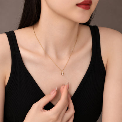 DANFÉE emerald-cut bezel lab-grown diamond necklace worn with a black top