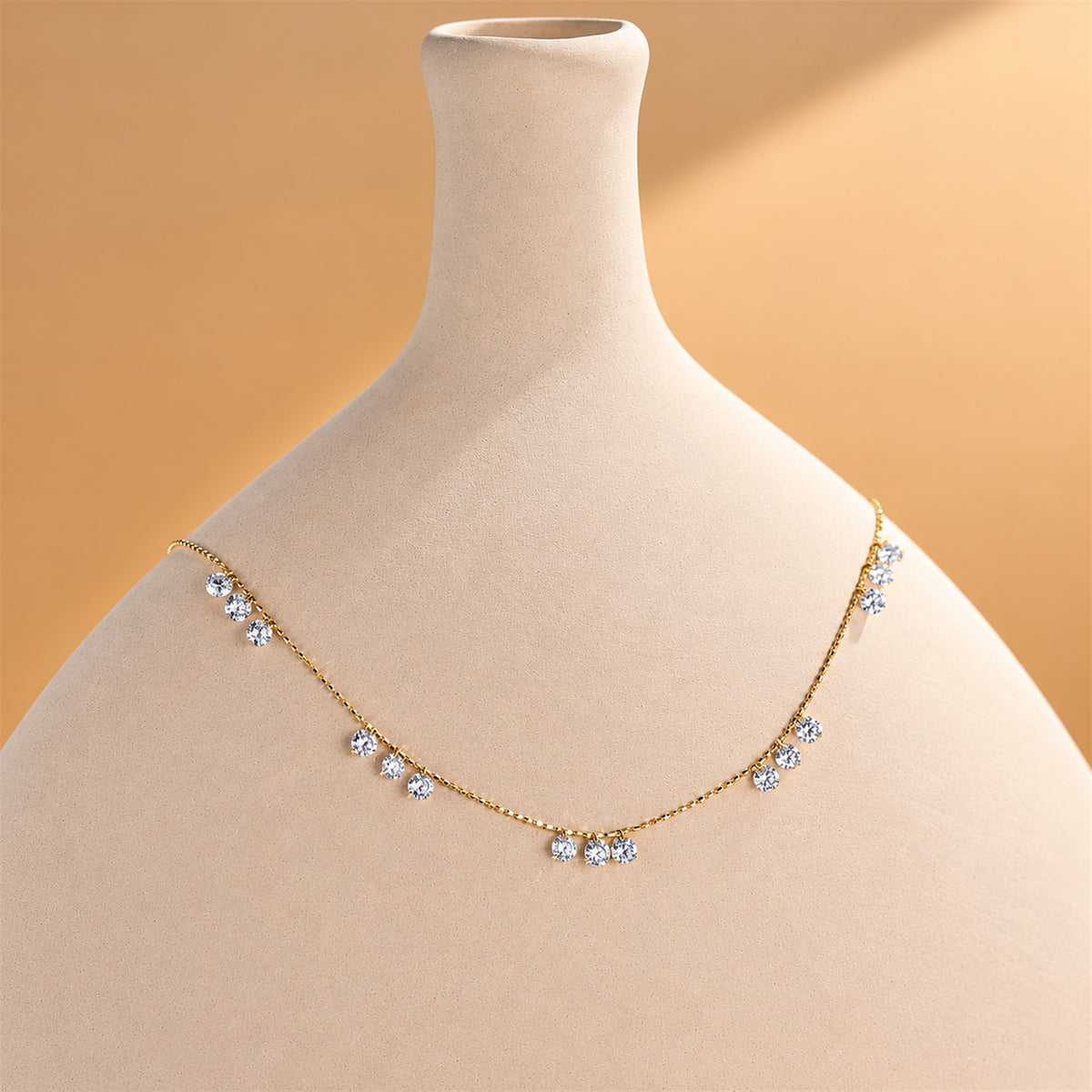 DANFÉE diamond necklace on a ceramic display
