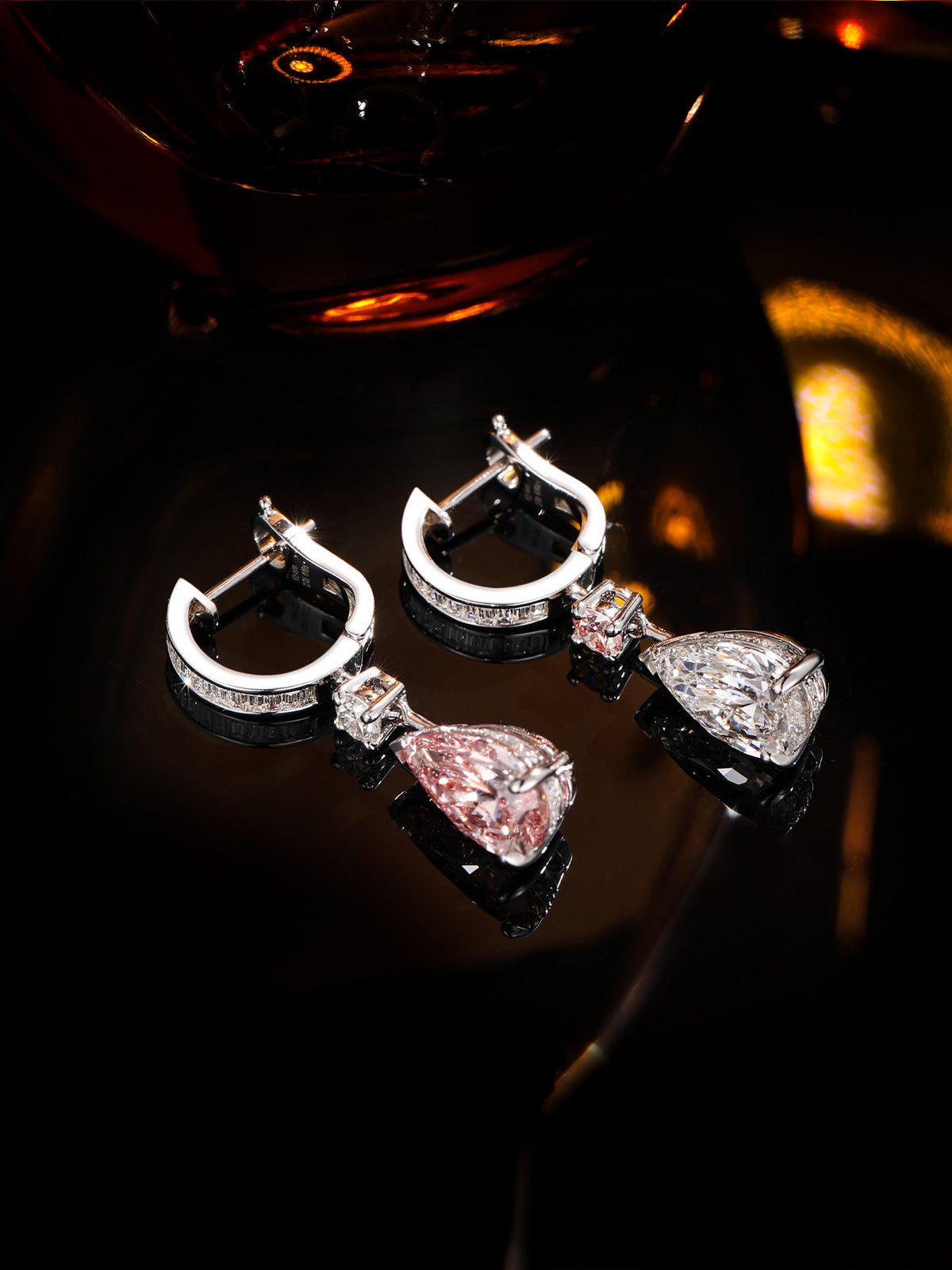 Rosée baguette huggie drop earrings with pink and white pear diamonds, dark scene