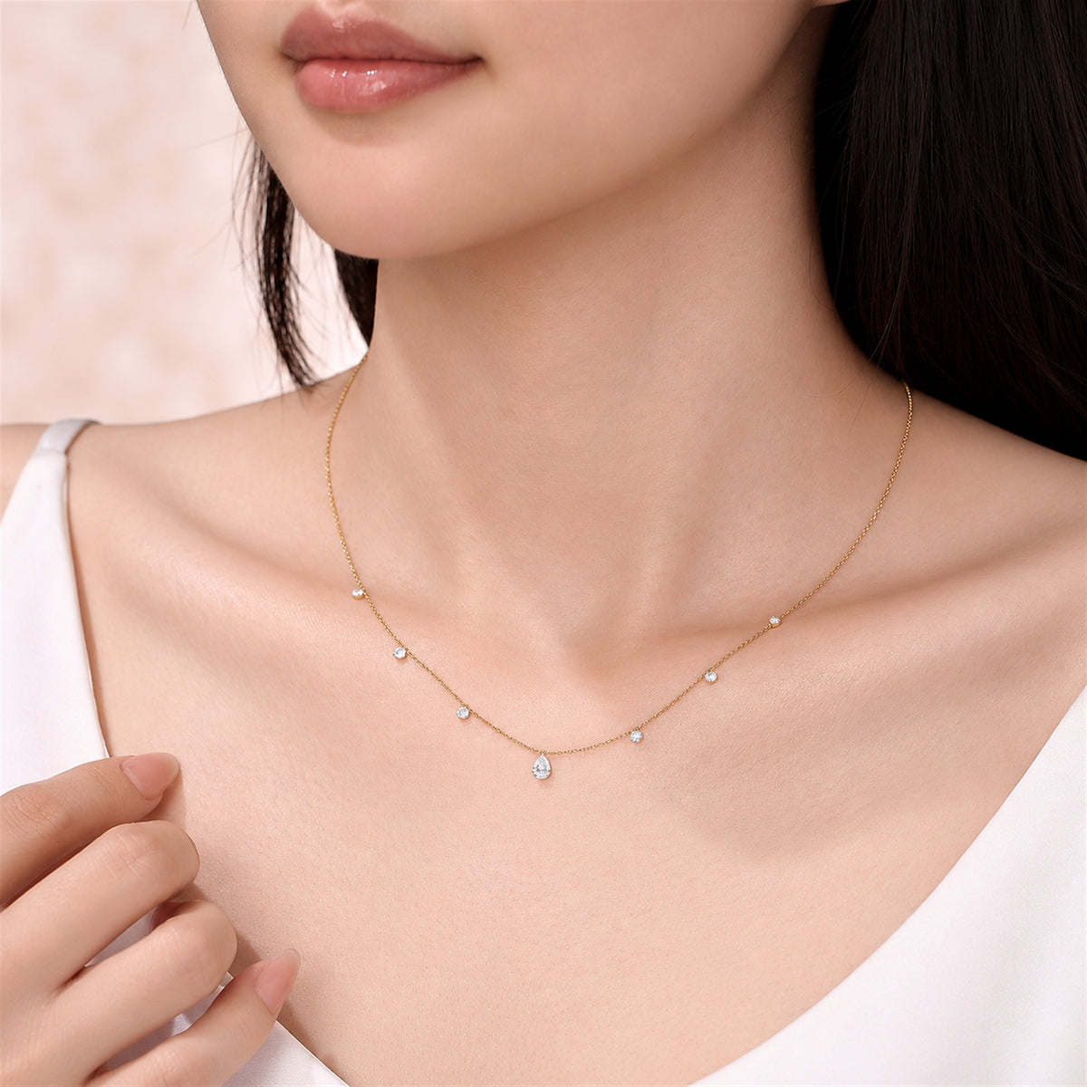DANFÉE pear and round lab-grown diamond drop necklace yellow gold worn on model