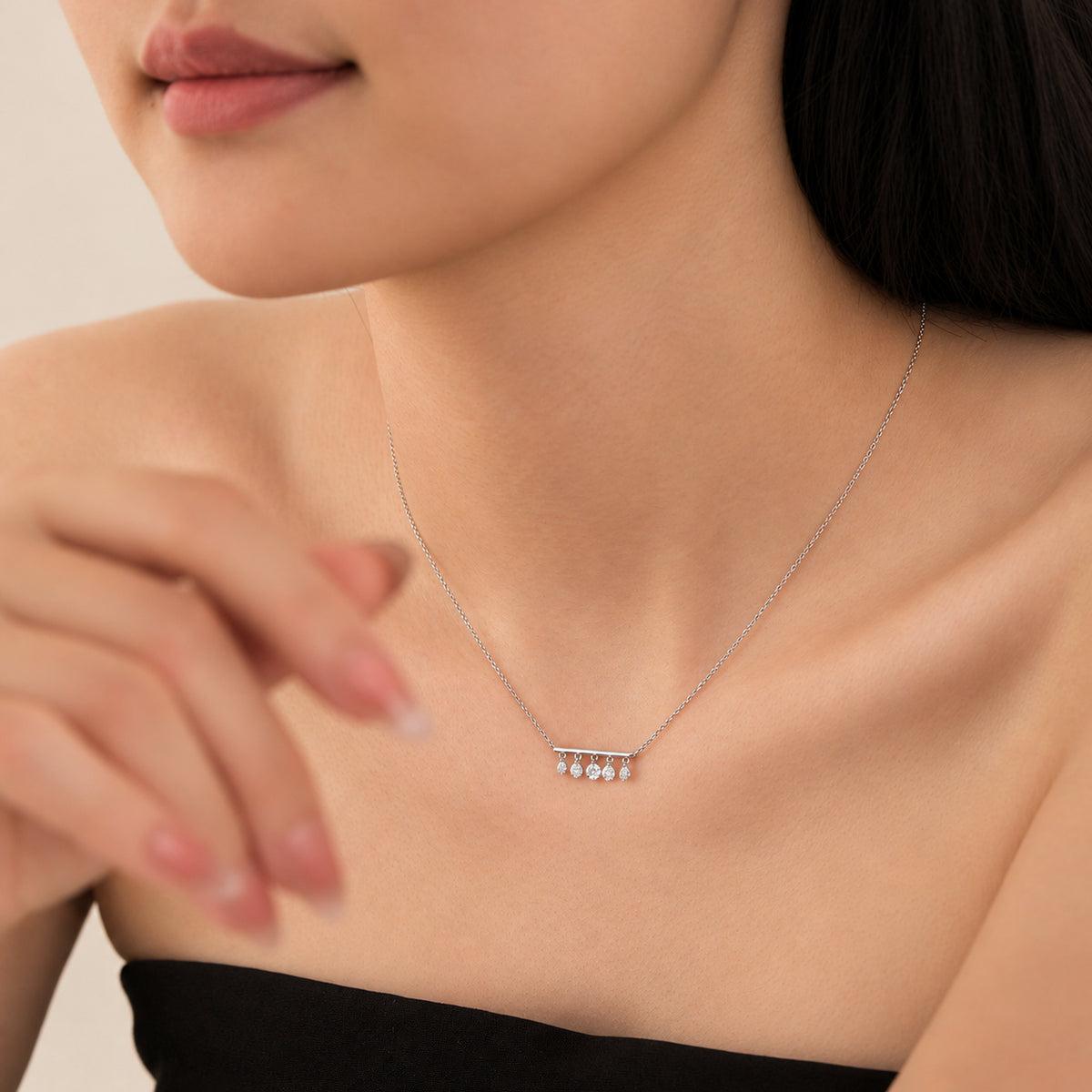 DANFÉE Five-diamond bar necklace worn with a black neckline