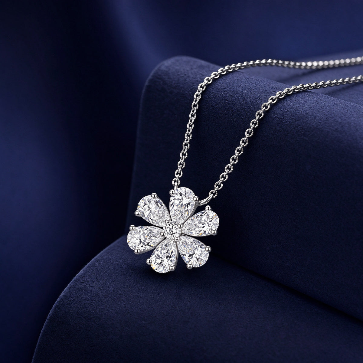 DANFÉE Forget-Me-Not lab-grown diamond necklace on a navy velvet display
