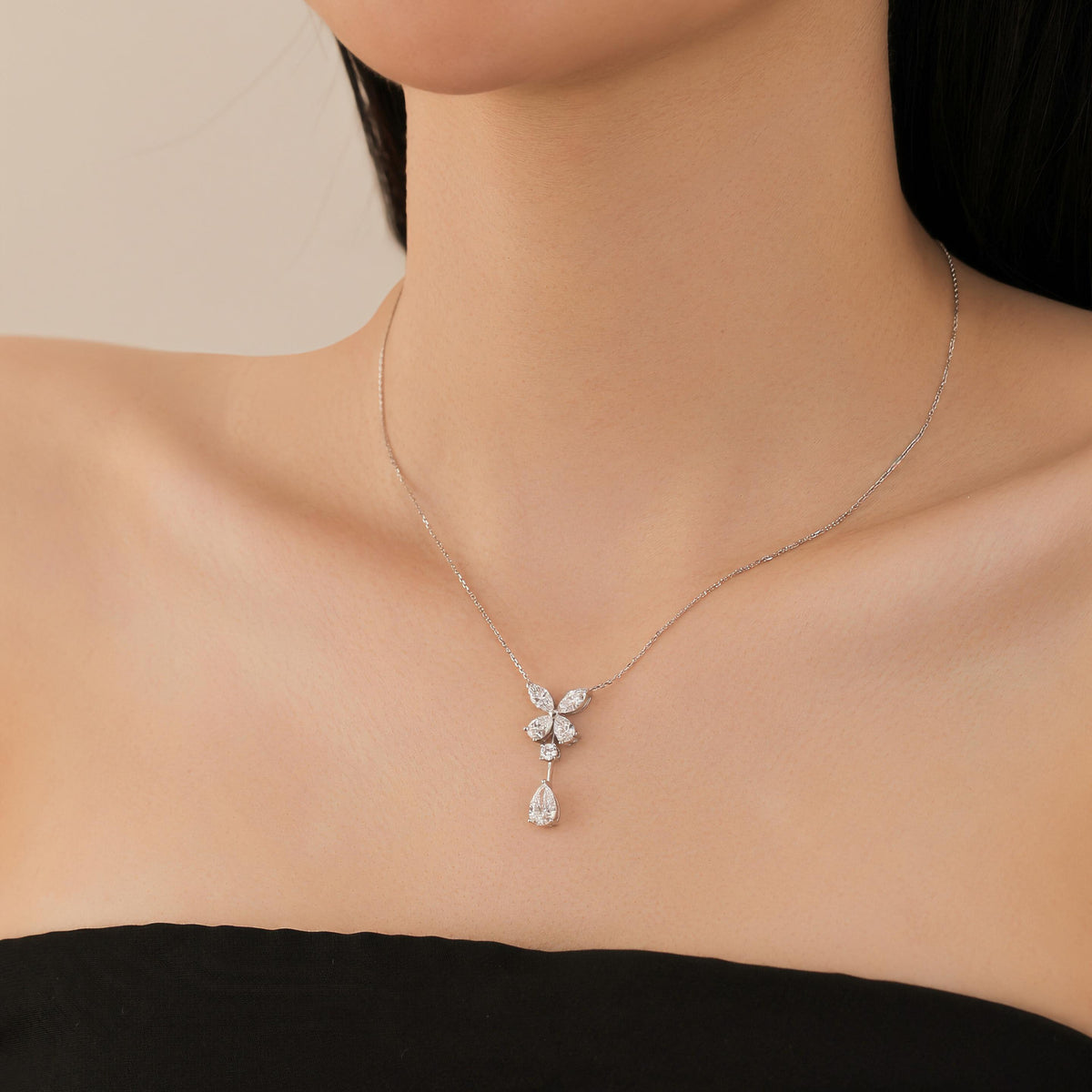 DANFÉE butterfly pear drop lab-grown diamond necklace worn at the collarbone
