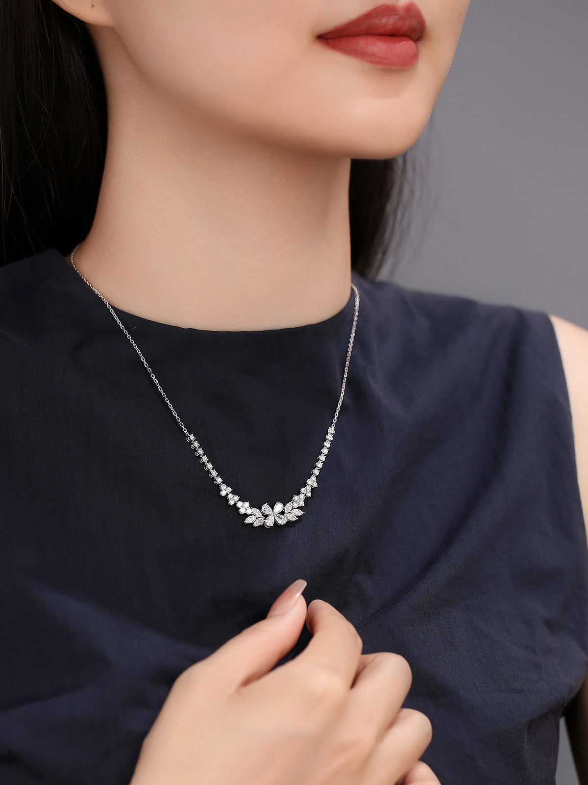 Model wearing DANFÉE Blossom Cluster lab-grown diamond necklace at the collarbone
