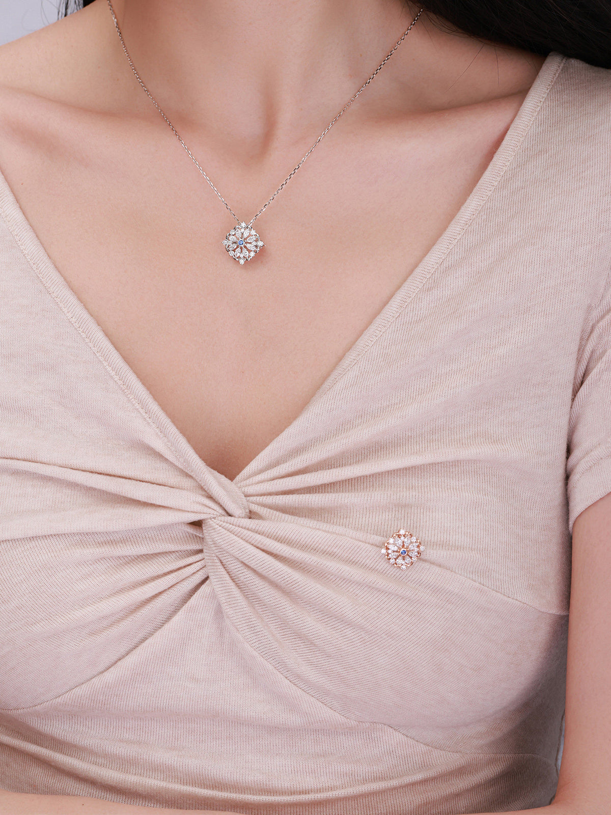 Model wearing DANFÉE Iris lab-grown diamond pendant and brooch together