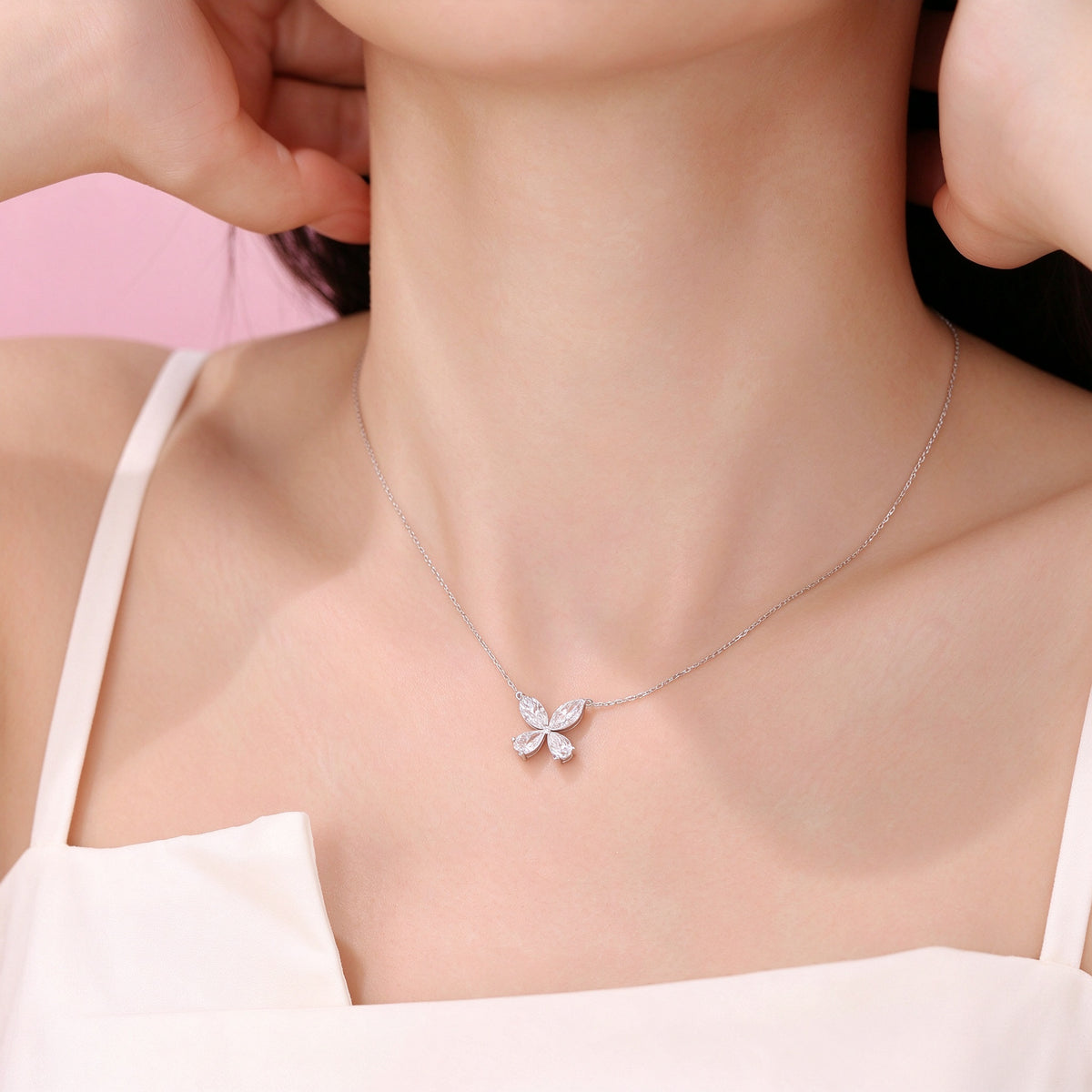 DANFÉE Four-Leaf Clover lab-grown diamond necklace worn by model, white camisole hand detail