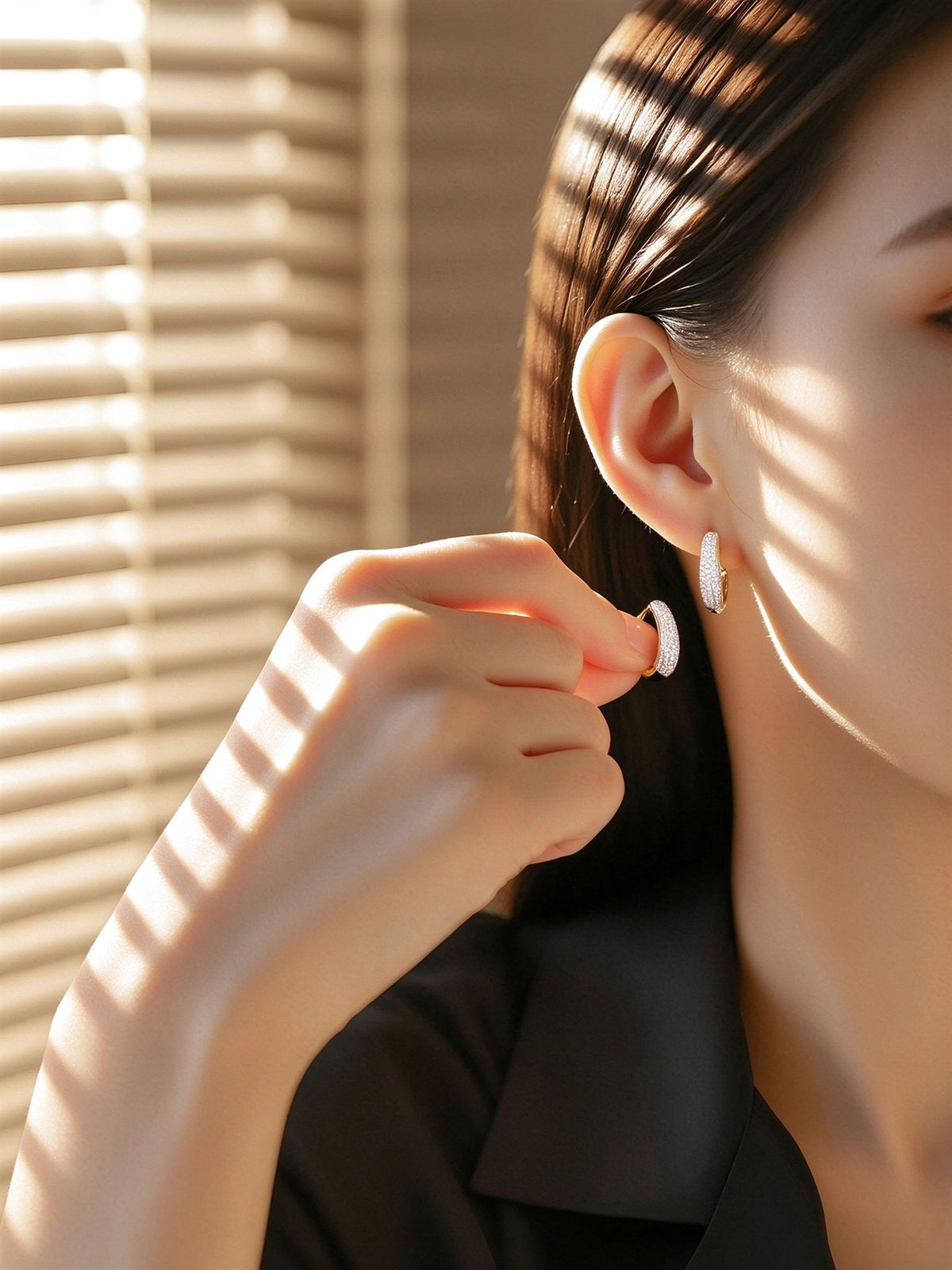 Model wearing pavé lab-grown diamond huggie earring