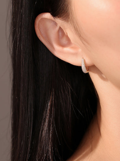Close-up of lab-grown diamond huggie earring on the lobe