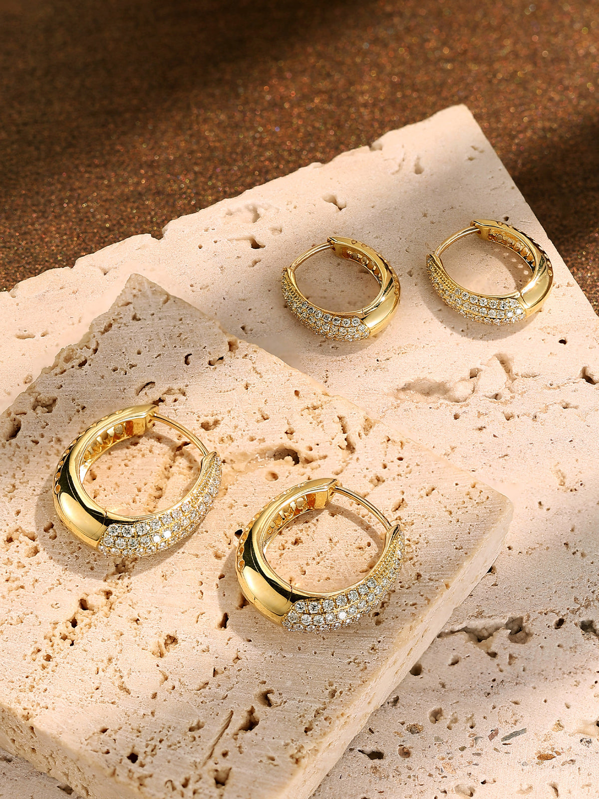 Small 8mm and large 12mm pavé diamond huggie earrings in 18K gold