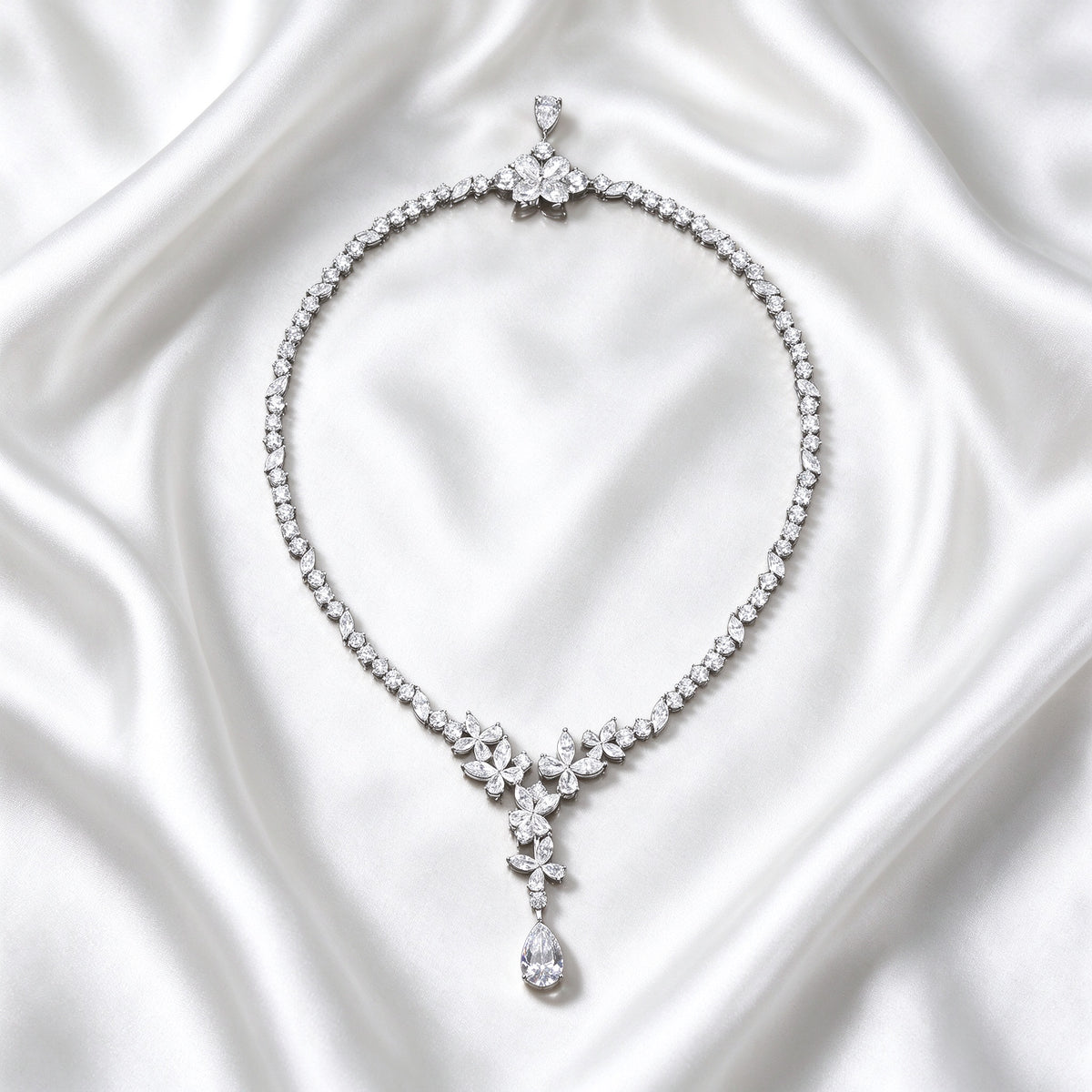 Blossom Cascade lab-grown diamond necklace laid on white silk