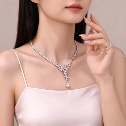 Model wearing 5 carat pear drop lab-grown diamond necklace in PT950 platinum for evening and bridal