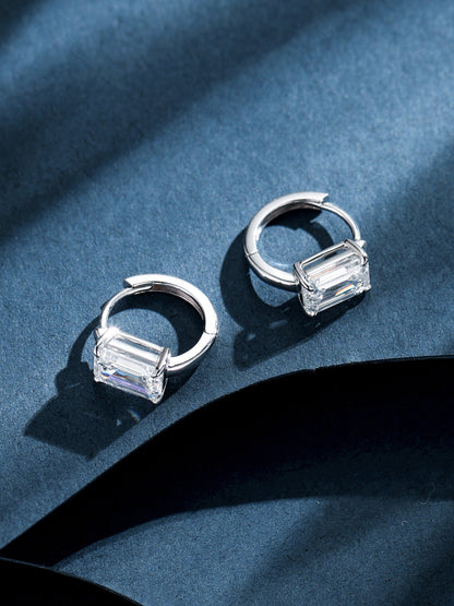 Emerald-cut diamond huggie hoops open, showing hinged snap closure