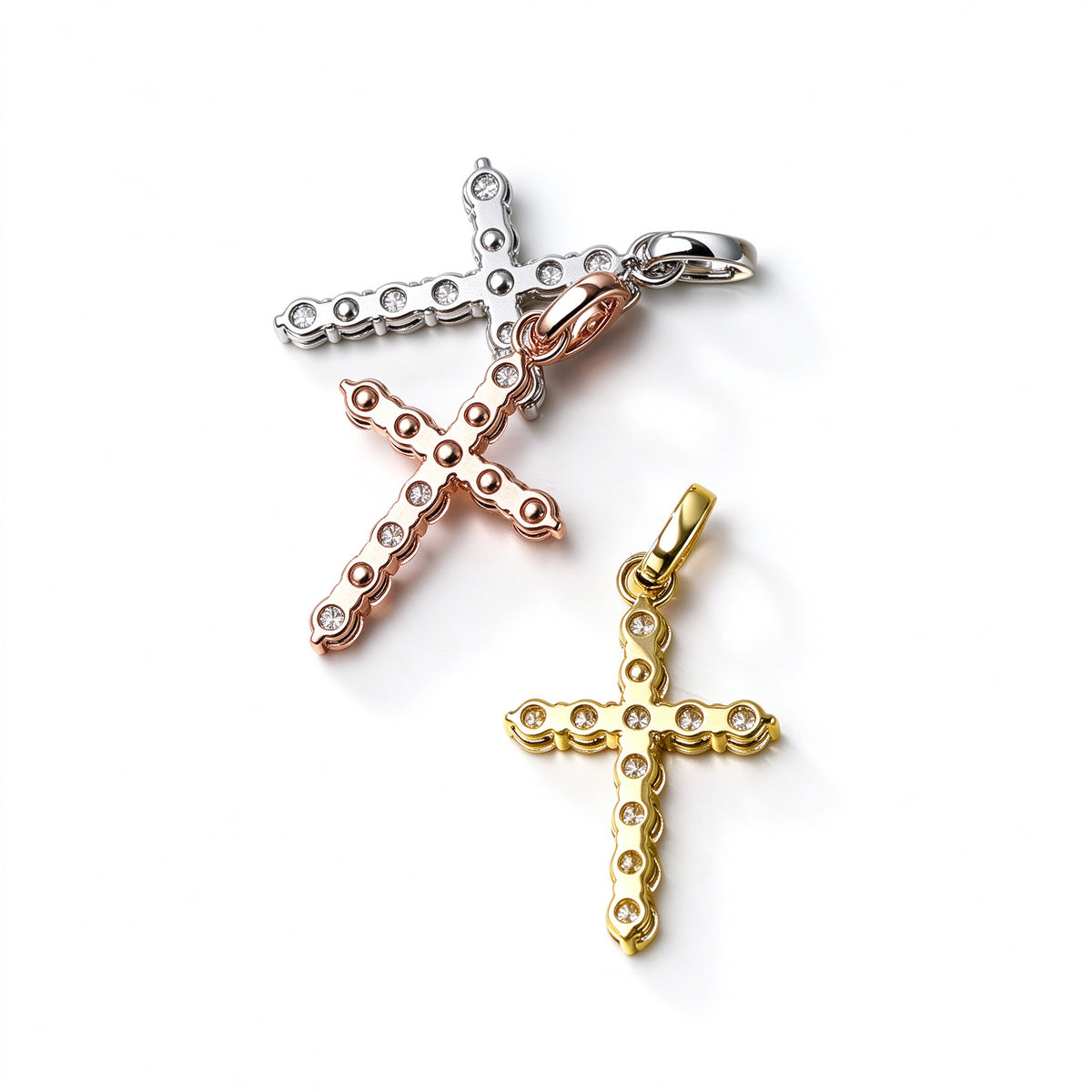 Back view of DANFÉE Celeste Cross pendants showing open prong settings