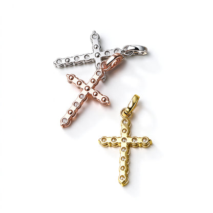 Back view of DANFÉE Celeste Cross pendants showing open prong settings
