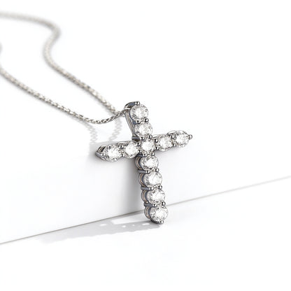 Platinum lab-grown diamond cross pendant, side view showing claw prongs