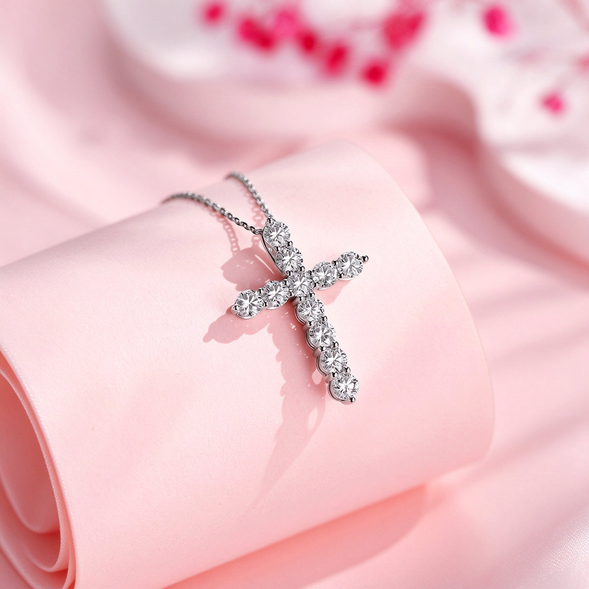 Close-up of eleven round lab-grown diamonds in a platinum cross