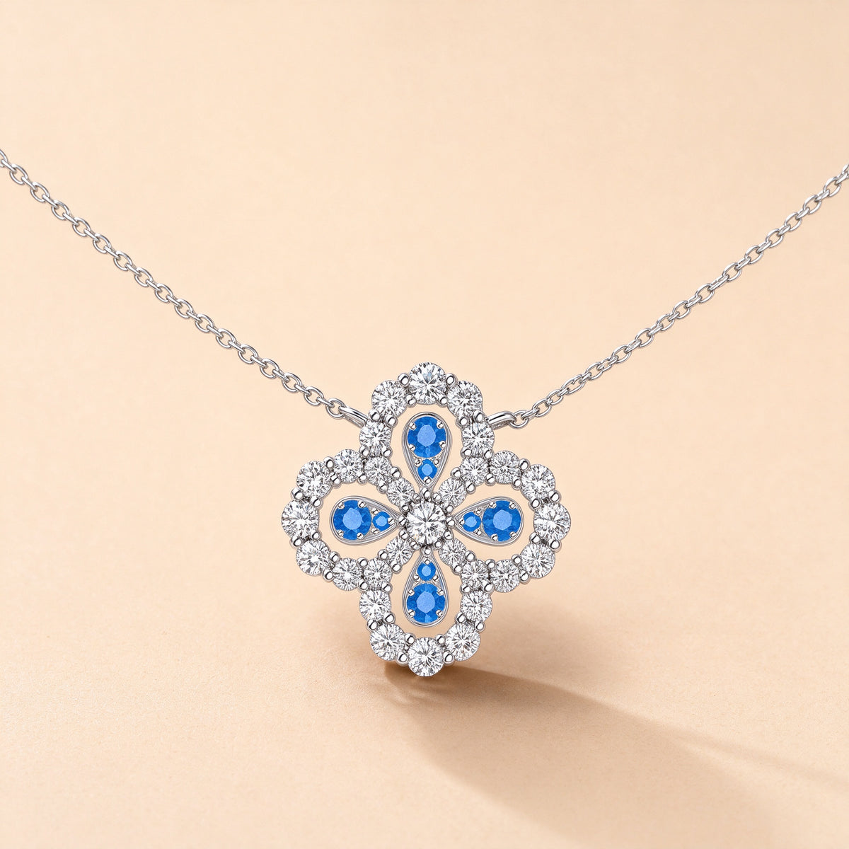 Clover Loop diamond necklace with pear-shaped blue spinel petals