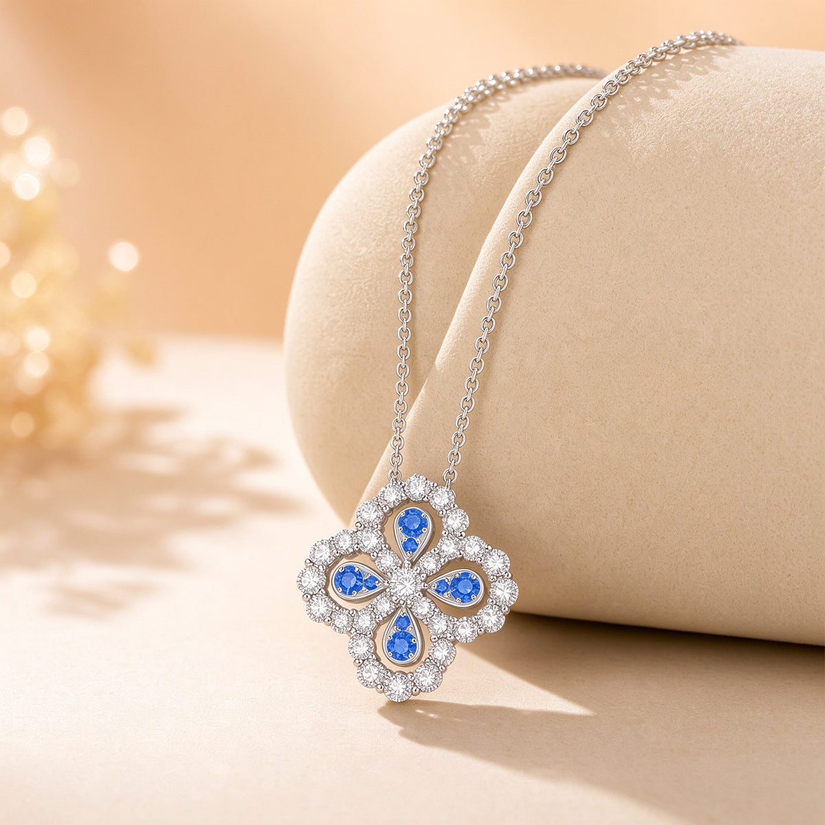 Clover Loop lab-grown diamond necklace displayed on a jewelry stand