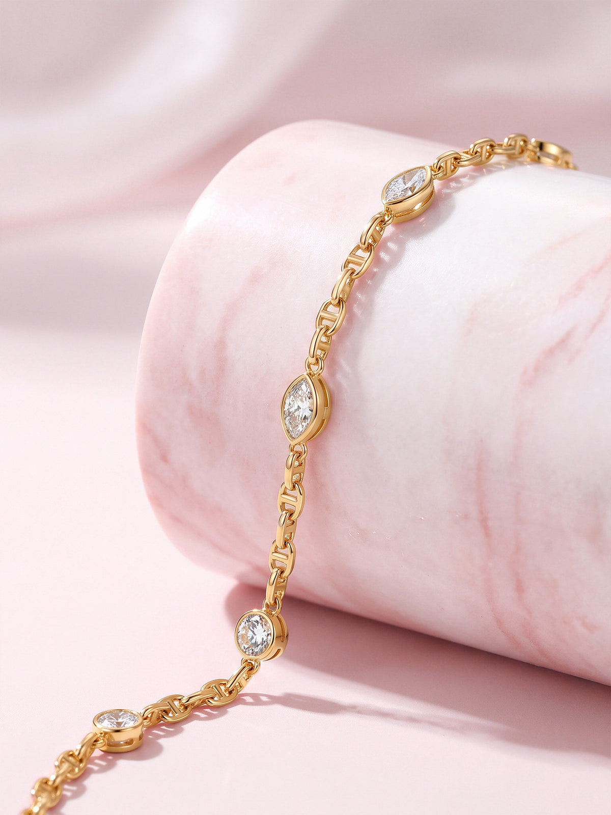 Bezel-set marquise and round lab-grown diamonds on an 18K gold mariner chain