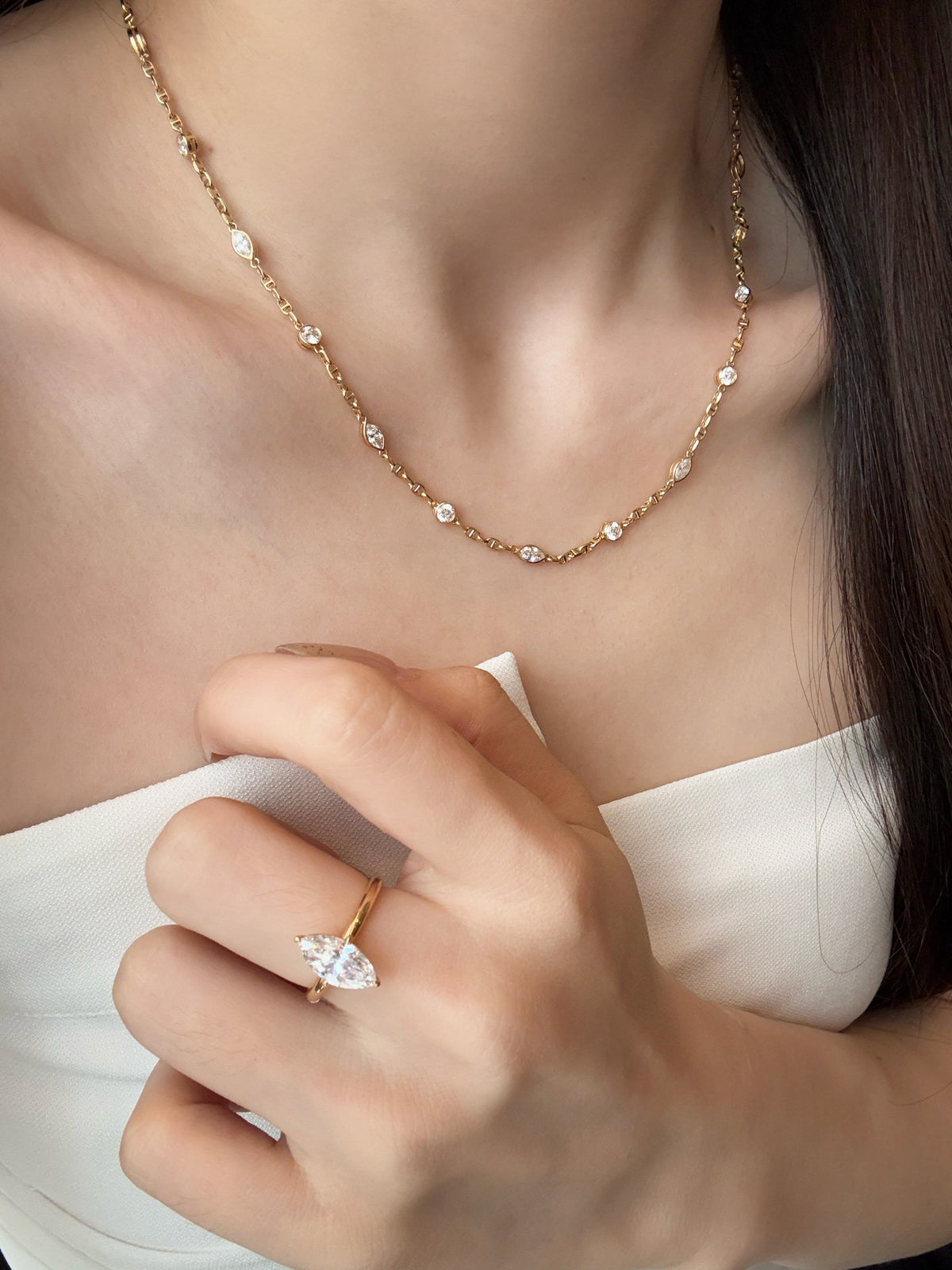 Model wearing the Constellation lab-grown diamond station necklace in 18K yellow gold