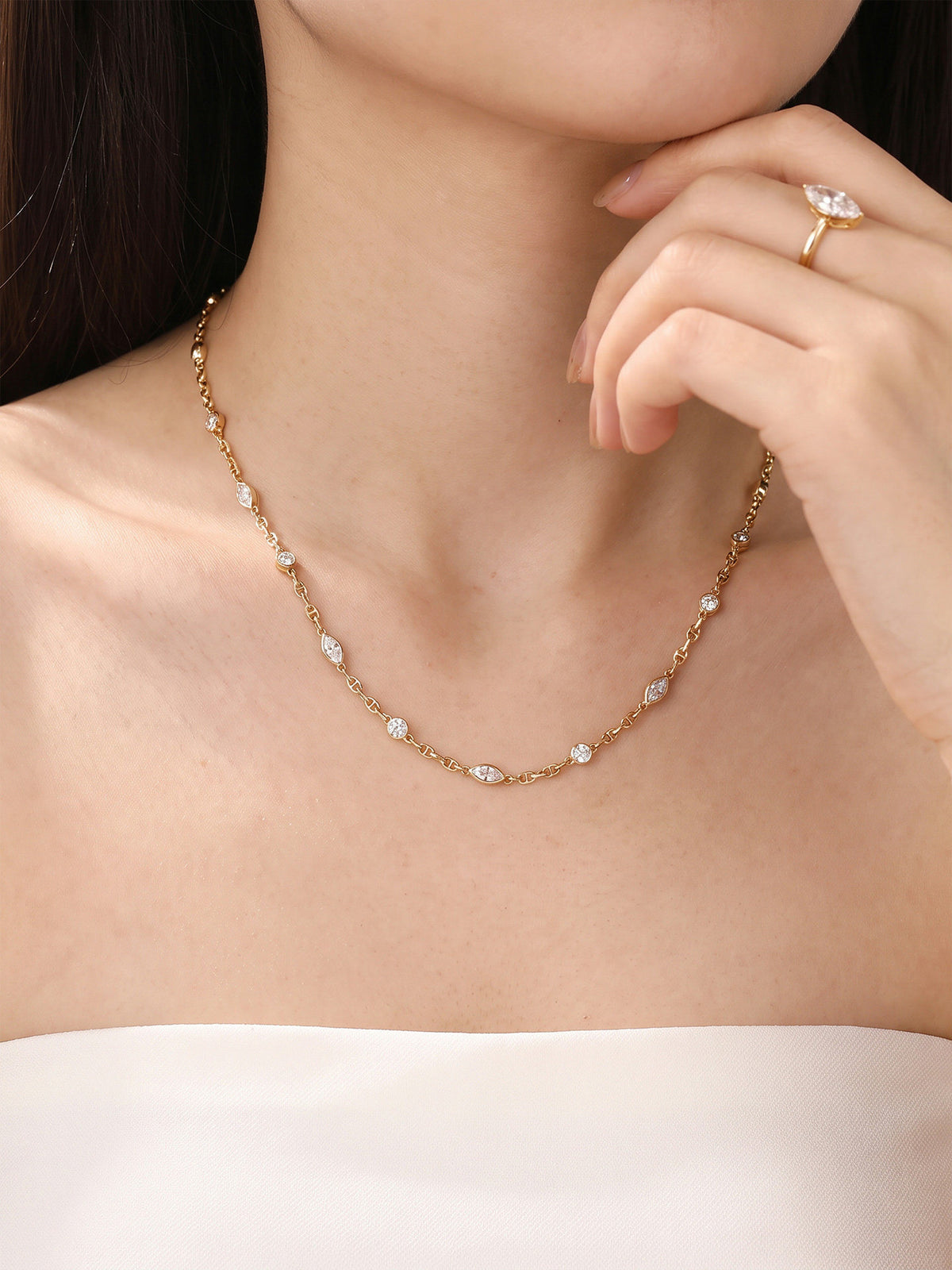 Lab-grown diamond station necklace worn at the collarbone