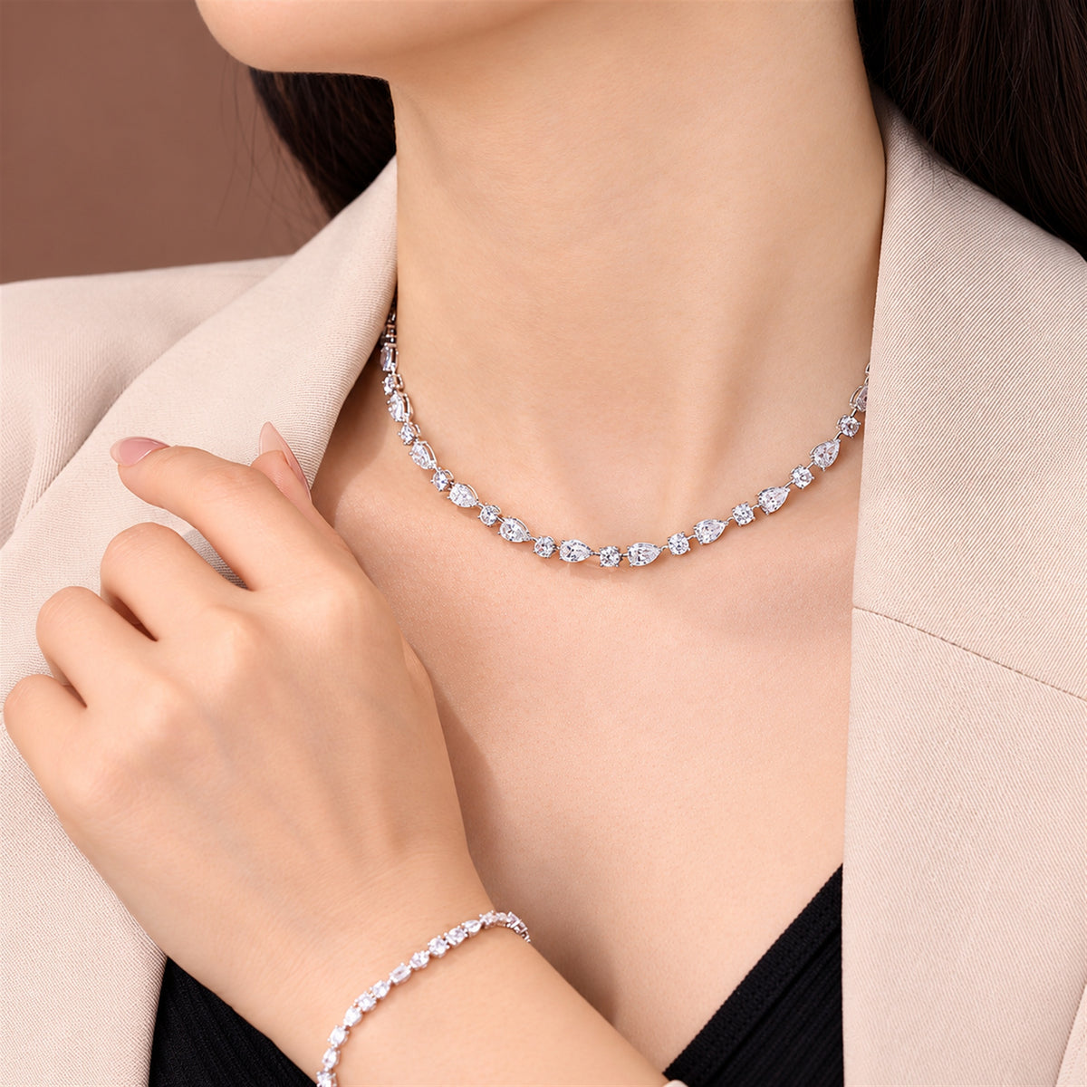 DANFÉE 21 carat pear and round lab-grown Model wearing pear and round diamond necklace