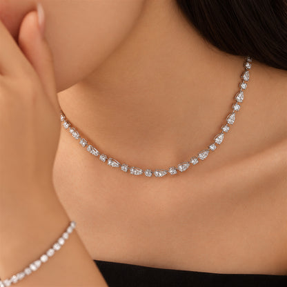 DANFÉE 21 carat pear and round lab-grown Model wearing pear and round diamond necklace