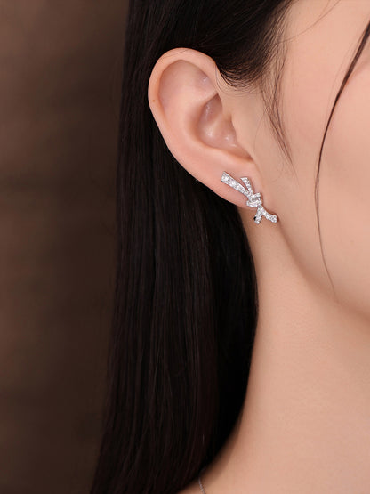 Close-up of lab-grown diamond bow stud on the ear