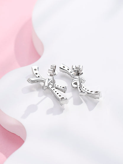 Back view of platinum bow stud earrings showing butterfly backs