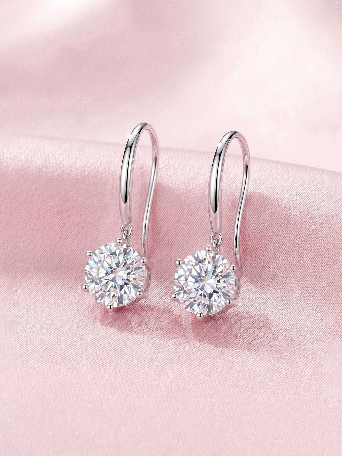 Aurore lab-grown diamond hook drop earrings in 18K white gold on pink satin