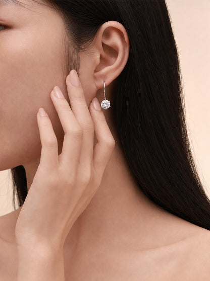 Aurore solitaire diamond drop earring worn on the ear