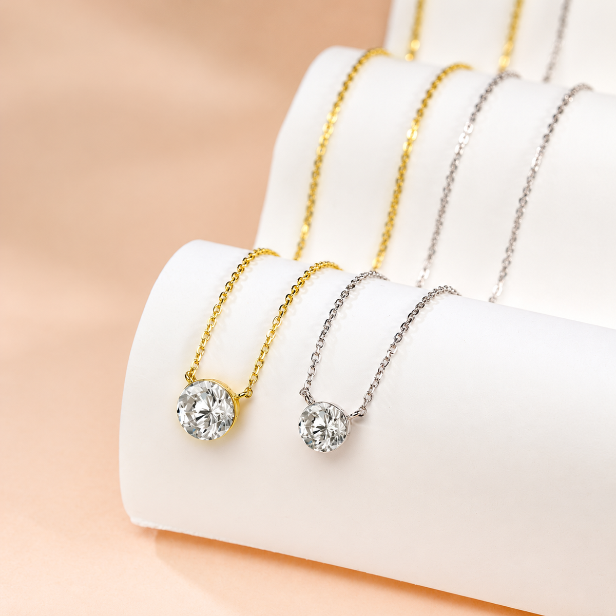 DANFÉE yellow and white gold bezel diamond necklaces displayed together