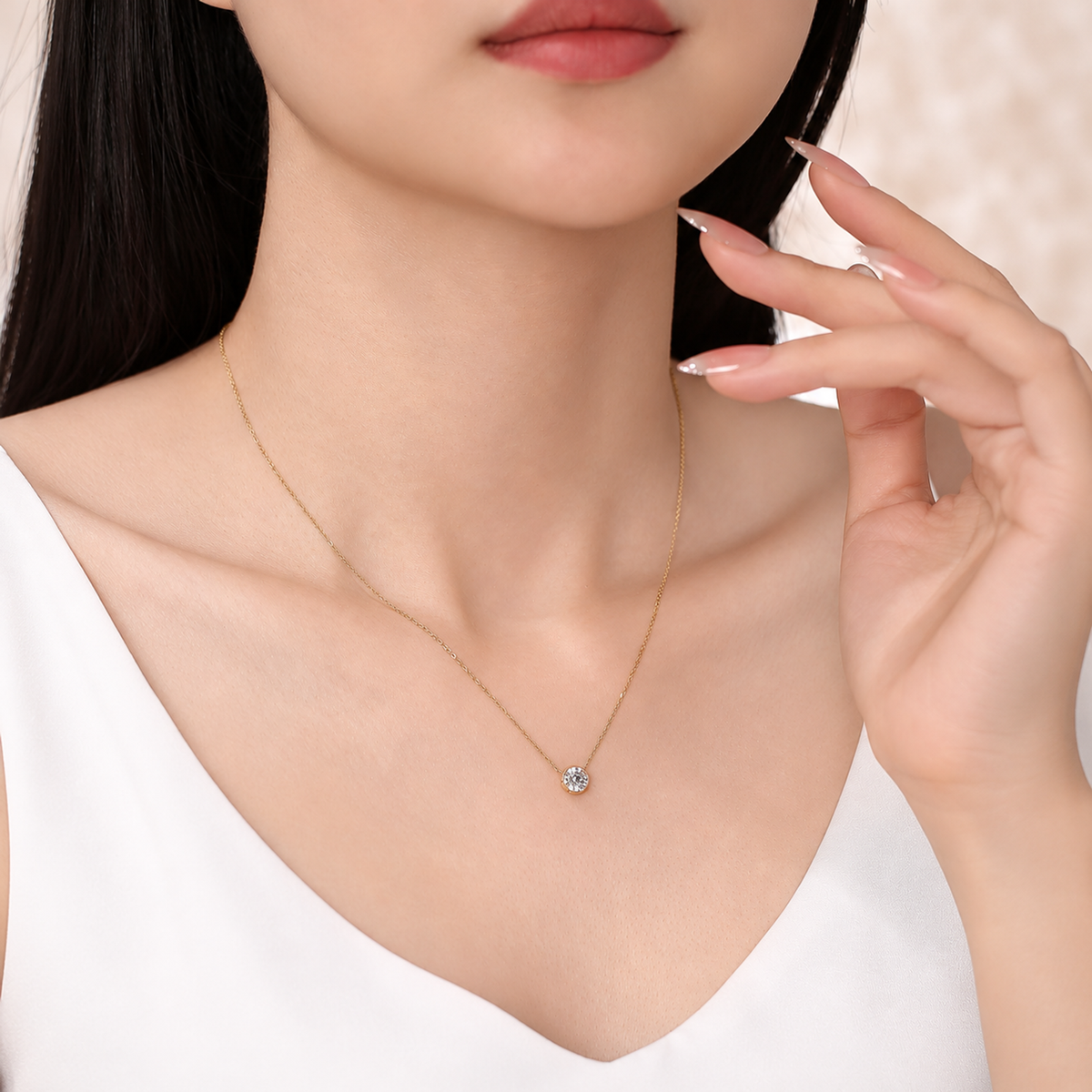DANFÉE bezel diamond necklace worn with a white top, third model view