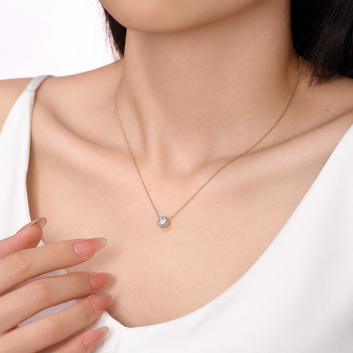 DANFÉE bezel-set lab-grown diamond necklace worn with a white top, second model view with hand