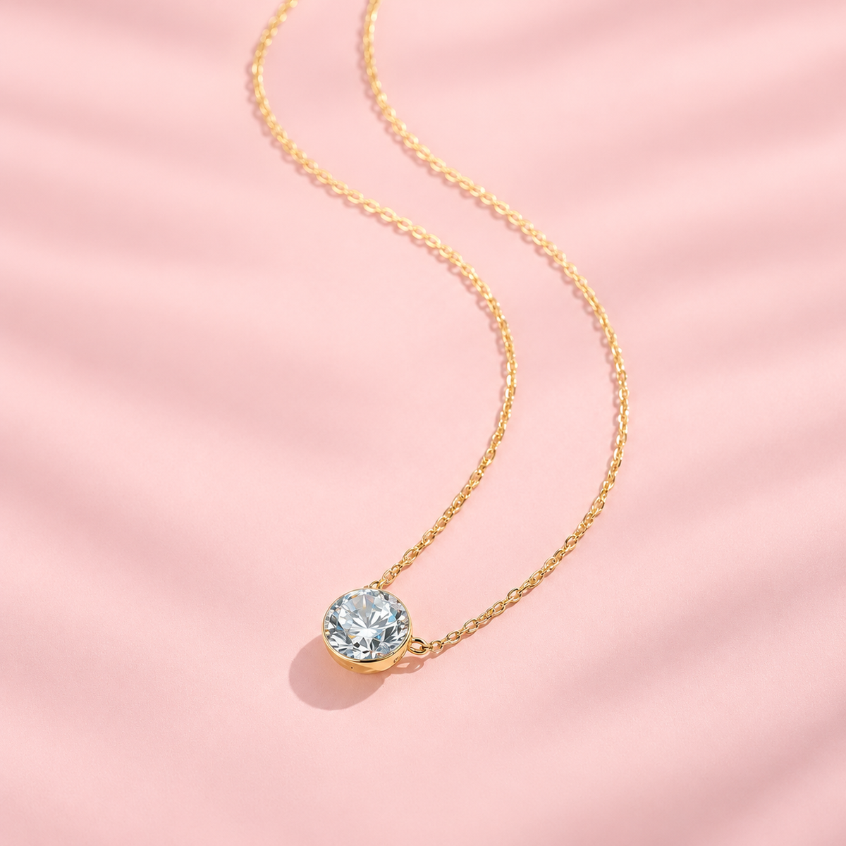DANFÉE 18K yellow gold bezel-set lab-grown diamond necklace on soft pink, original source image 02