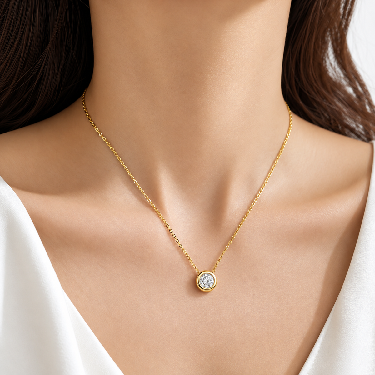 DANFÉE 18K yellow gold bubble bezel diamond necklace worn with a white top