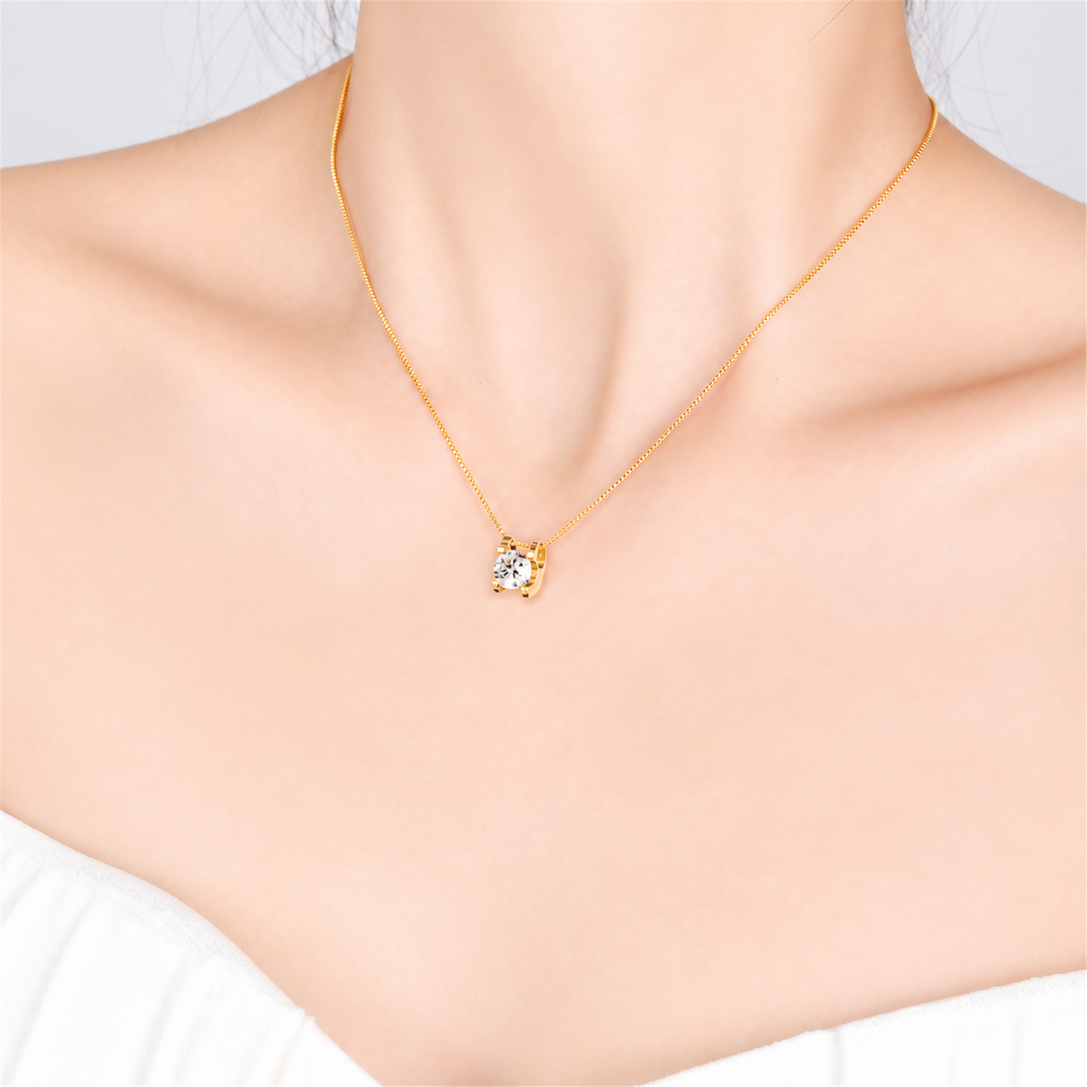 Bull-head diamond pendant necklace worn in yellow gold, model view